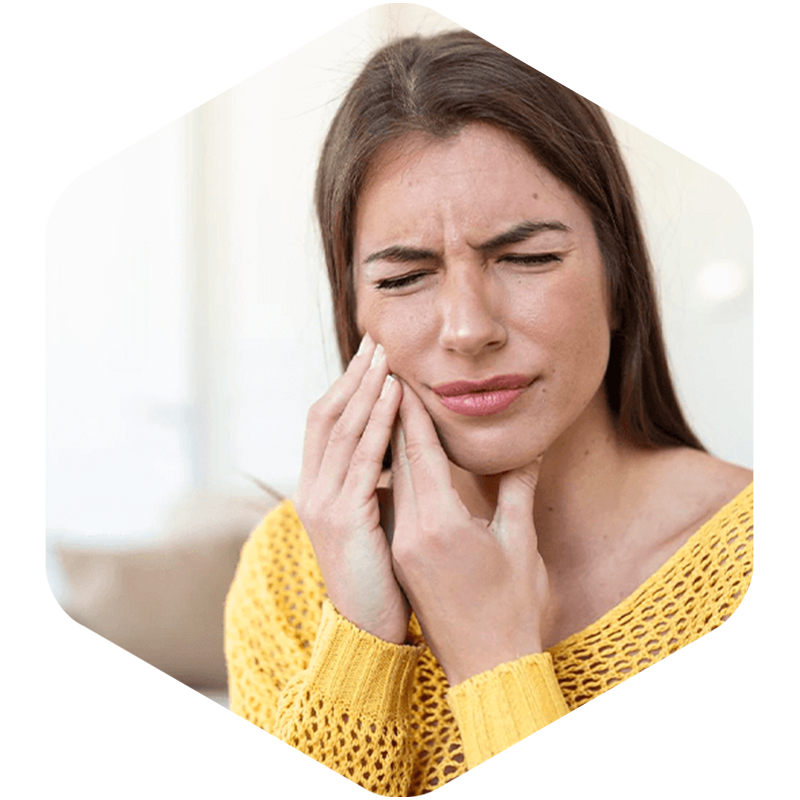 Woman touching tooth for pain